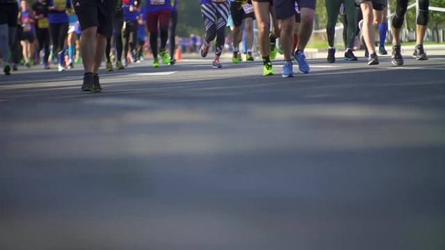 Hundreds of people run in a sports marathon