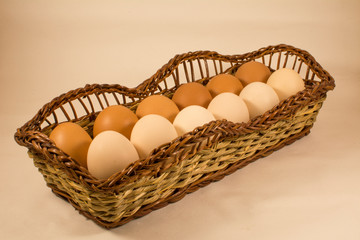 Chicken eggs in a long basket