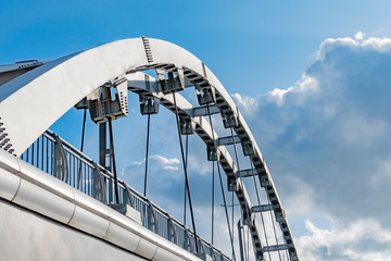 Fototapeta premium Fragment of the arch of the new bridge over the river