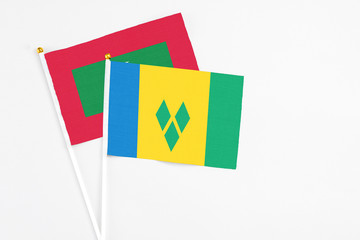 Saint Vincent And The Grenadines and Maldives stick flags on white background. High quality fabric,...