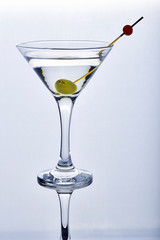 Cocktail dry martini with olive in isolated glass on white background