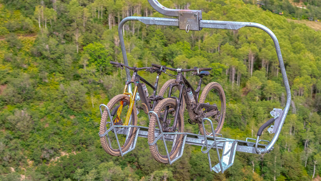 Panorama Close Up Of Chairlifts With Mountain Bikes In Park City Ski Resort At Off Season