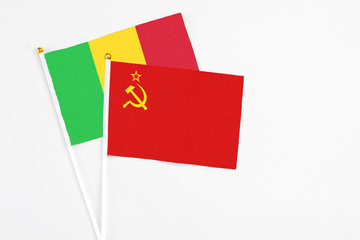 Soviet Union and Mali stick flags on white background. High quality fabric, miniature national flag. Peaceful global concept.White floor for copy space.