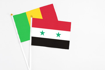 Syria and Mali stick flags on white background. High quality fabric, miniature national flag....