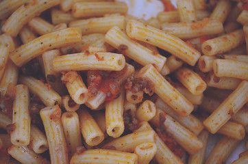 plate of pasta bolognese on dark table, top view