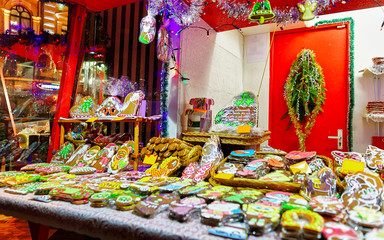 Fototapeta premium One of the most traditional sweet treats which are gingerbreads pictured on Christmas Market in Riga, Latvia. German street Xmas and holiday fair. Advent Decoration and Stalls on Bazaar