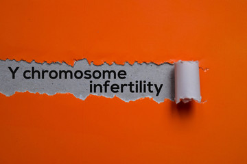 Y chromosome infertility Text written in torn paper. Medical concept