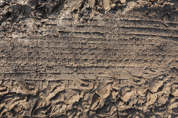 Abstract background. Tire tracks in the mud