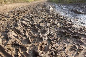 Abstract background. Tire tracks in the mud