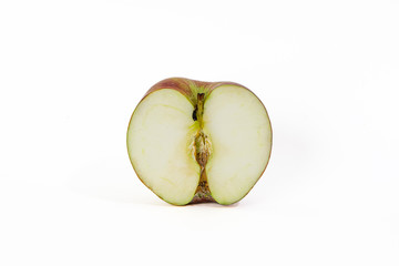 A green and red Apple cut in half