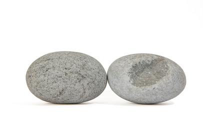 Two oval white pebbles side by side