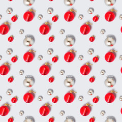 Merry Christmas and New Year seamless pattern. rhythmic ornament of silver and red shiny balls of Christmas decorations. Packaging concept, background, ornament