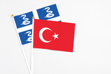 Turkey and Martinique stick flags on white background. High quality fabric, miniature national flag. Peaceful global concept.White floor for copy space.