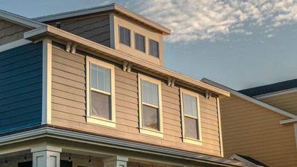Panorama frame Sash windows in the upper floor of a timber house