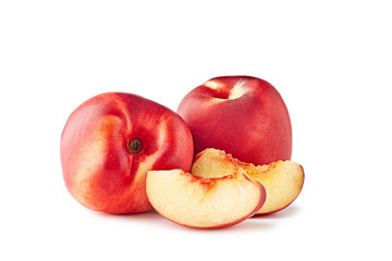 Two ripe nectarines with slices on white background