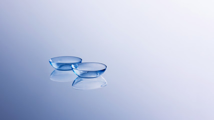 Contact lenses on light blue background. Eyewear, eyesight, eye care and health, ophthalmology and...