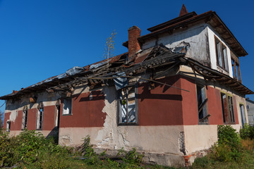 An abandoned and dilapidated house that needs major renovation.