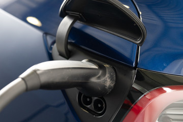Tesla car blue recharging electric vehicle model 3