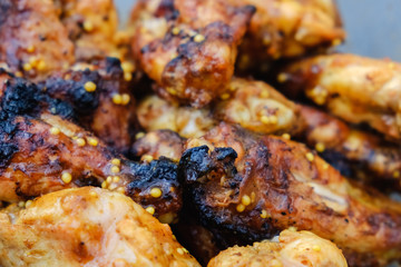 Grilled chicken wings in plate.