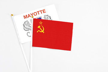 Soviet Union and Mayotte stick flags on white background. High quality fabric, miniature national flag. Peaceful global concept.White floor for copy space.