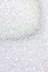 Obraz premium Silver glitter texture background, sparkling Christmas wallpaper.