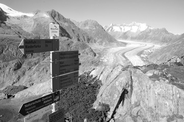 trekking path with panoramic view to the melting Aletschglacier.