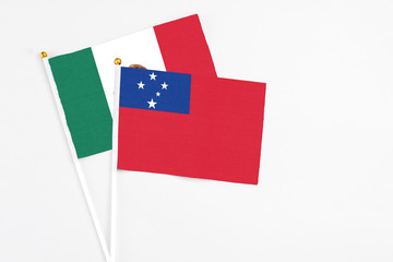 Samoa and Mexico stick flags on white background. High quality fabric, miniature national flag. Peaceful global concept.White floor for copy space.