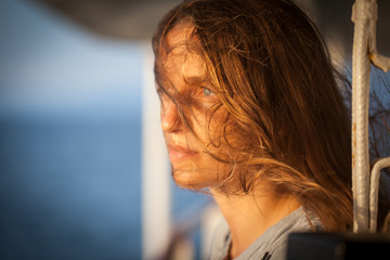 portrait of a young red-haired girl on a ship