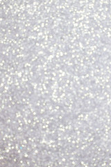 Silver glitter texture background, sparkling Christmas wallpaper.