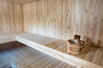 Fototapeta na wymiar Sauna bench with bucket and ladle 