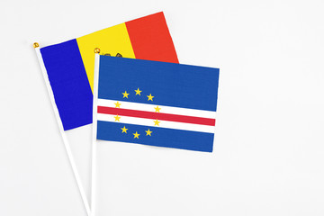 Cape Verde and Moldova stick flags on white background. High quality fabric, miniature national flag. Peaceful global concept.White floor for copy space.