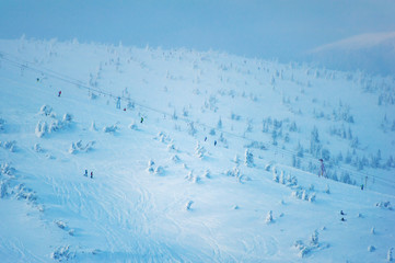 people go skiing at the top of the mountain