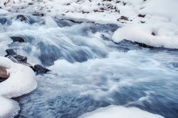 mountain river, ice and water. winter landscape