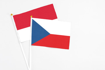 Czech Republic and Monaco stick flags on white background. High quality fabric, miniature national flag. Peaceful global concept.White floor for copy space.