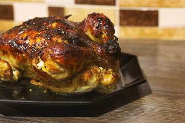 Chicken on a black plate. Thanksgiving Day