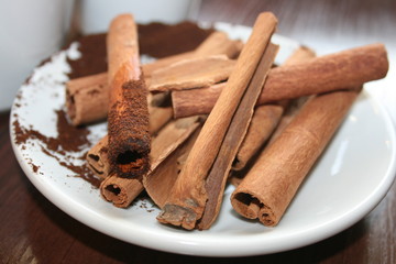 cinnamon sticks and powder on white background