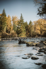 Fisherman Casting in River