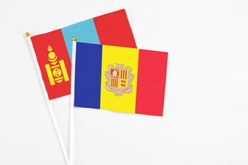 Andorra and Mongolia stick flags on white background. High quality fabric, miniature national flag. Peaceful global concept.White floor for copy space.