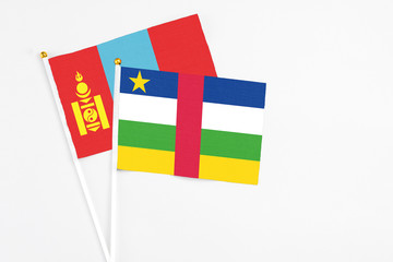 Central African Republic and Mongolia stick flags on white background. High quality fabric, miniature national flag. Peaceful global concept.White floor for copy space.