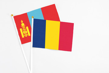 Chad and Mongolia stick flags on white background. High quality fabric, miniature national flag....