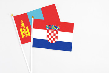 Croatia and Mongolia stick flags on white background. High quality fabric, miniature national flag....