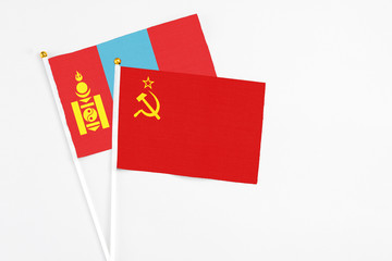 Soviet Union and Mongolia stick flags on white background. High quality fabric, miniature national flag. Peaceful global concept.White floor for copy space.