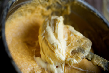 Easter bread making process. adding butter to the dough..