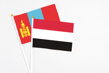Yemen and Mongolia stick flags on white background. High quality fabric, miniature national flag. Peaceful global concept.White floor for copy space.