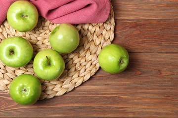 juicy green apples on a wooden table.