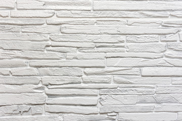 White stone wall background or texture. Construction industry.