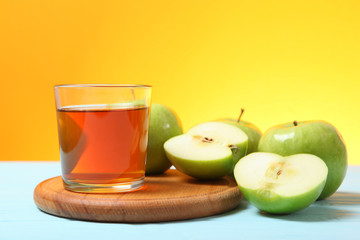juice from green apples on the table.