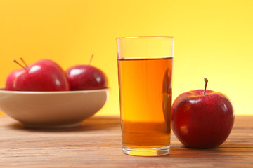 apple juice from red apples on the table. 