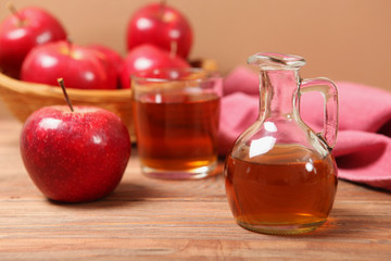 apples and apple cider vinegar on the table.