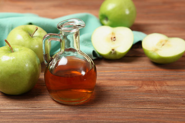 apples and apple cider vinegar on the table.
